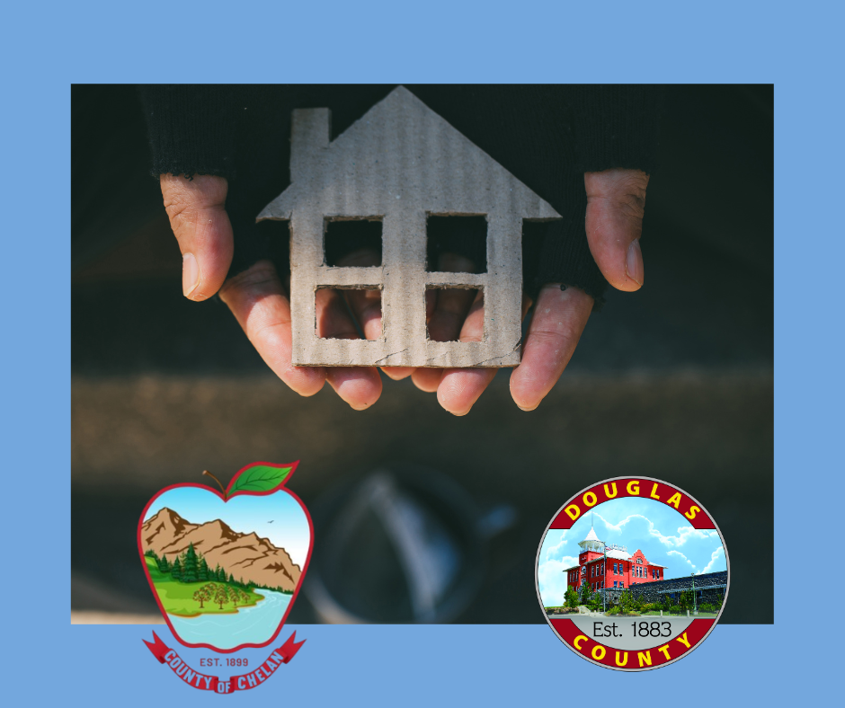 Hands holding small house 